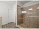 This bathroom features a glass door shower with tile walls and floors at 5575 Mirror Lake Dr, Cumming, GA 30028
