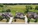 An aerial view captures a stately two-story home with a manicured lawn surrounded by lush greenery at 5915 Read Rd, Suwanee, GA 30024