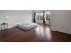 Bright bedroom with hardwood floors, and three windows providing ample light at 5915 Read Rd, Suwanee, GA 30024