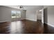Bedroom featuring hardwood floors and natural light from two windows at 5915 Read Rd, Suwanee, GA 30024