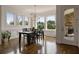 Cozy dining area with natural light, views of the backyard, and an adjacent door to the porch at 5915 Read Rd, Suwanee, GA 30024