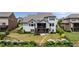 Back of home and backyard with manicured lawn, fenced yard, deck, and garden at 5915 Read Rd, Suwanee, GA 30024