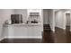 Kitchenette featuring granite countertop, microwave, and stainless steel refrigerator at 5915 Read Rd, Suwanee, GA 30024