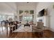 Bright living room boasts hardwood floors, fireplace, tall windows, and an open floor plan at 5915 Read Rd, Suwanee, GA 30024