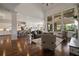 Inviting living room features hardwood floors, fireplace, tall windows, and an open floor plan at 5915 Read Rd, Suwanee, GA 30024