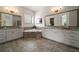 Luxury bathroom features a soaking tub, dual vanities, and elegant tile flooring at 5915 Read Rd, Suwanee, GA 30024