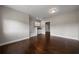 Well-lit room with hardwood floors, featuring a grooming station and access to other spaces at 5915 Read Rd, Suwanee, GA 30024