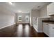 Versatile room with light walls, wood floors, and a pet-washing station with a shower and cabinets at 5915 Read Rd, Suwanee, GA 30024