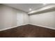 Neutral-colored room with wood floors, simple design and white door leading to other spaces at 5915 Read Rd, Suwanee, GA 30024