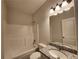 Bright bathroom featuring granite countertops, a spacious tub, and a modern design at 68 Jeffrey Ln, Dallas, GA 30157