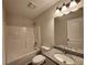 Bathroom with tub/shower combo, single vanity with granite countertop, and modern fixtures at 68 Jeffrey Ln, Dallas, GA 30157