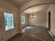 This open-concept home boasts an elegant chandelier and abundant natural light from the large windows at 68 Jeffrey Ln, Dallas, GA 30157