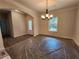 Dining room featuring an elegant chandelier and access to other living spaces at 68 Jeffrey Ln, Dallas, GA 30157