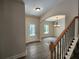 Open-concept home featuring stylish floors, arched doorways, and elegant chandelier lighting at 68 Jeffrey Ln, Dallas, GA 30157