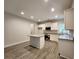 Modern kitchen featuring an island, white cabinets, granite countertops, and stainless steel appliances at 68 Jeffrey Ln, Dallas, GA 30157