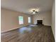 Spacious living room featuring luxury flooring, a fireplace, and plentiful natural light at 68 Jeffrey Ln, Dallas, GA 30157