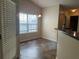 Inviting dining space with hanging chandelier and view to the kitchen and entry way at 1241 Key Manor Ln, Lawrenceville, GA 30045