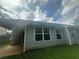 A single-story house featuring two large windows and a small, sheltered porch area at 1241 Key Manor Ln, Lawrenceville, GA 30045