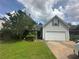 Charming single-Gathering home featuring a two-car garage and well-maintained landscaping at 1241 Key Manor Ln, Lawrenceville, GA 30045
