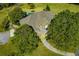 Aerial view of a home showcasing the layout of the property, mature trees and a swimming pool at 197 Westbrook Rd, Carrollton, GA 30116