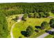Secluded estate with sprawling lawn and private driveway surrounded by lush trees at 197 Westbrook Rd, Carrollton, GA 30116