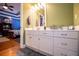 Well-lit bathroom with green walls and access to the main bedroom at 197 Westbrook Rd, Carrollton, GA 30116