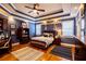 Comfortable bedroom featuring a tray ceiling and well-lit windows at 197 Westbrook Rd, Carrollton, GA 30116