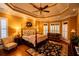 Elegant bedroom features a tray ceiling, hardwood floors and a four-poster bed at 197 Westbrook Rd, Carrollton, GA 30116