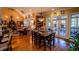 Dining room with hardwood floors and a view into the living space and backyard at 197 Westbrook Rd, Carrollton, GA 30116