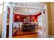 Elegant dining room with red walls, white trim, a chandelier, and a large table set for a formal dinner at 197 Westbrook Rd, Carrollton, GA 30116