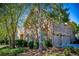Brick home featuring a three-car garage and well-maintained landscaping, blending elegance and functionality at 197 Westbrook Rd, Carrollton, GA 30116
