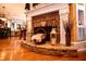 Close up of the stone fireplace with decor and hardwood floors at 197 Westbrook Rd, Carrollton, GA 30116