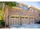 Spacious three-car garage with brick exterior, offering ample parking and storage at 197 Westbrook Rd, Carrollton, GA 30116