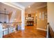 Upstairs landing featuring hardwood floors, decorative iron railing, and picture gallery at 197 Westbrook Rd, Carrollton, GA 30116
