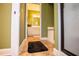Hallway view leading to a bright, clean bathroom with tiled floors at 197 Westbrook Rd, Carrollton, GA 30116