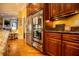 Gourmet kitchen features stainless steel appliances and granite countertops with dark wood cabinetry at 197 Westbrook Rd, Carrollton, GA 30116