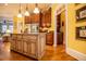 Spacious kitchen offers island with granite countertops, stainless appliances and dark wood cabinets at 197 Westbrook Rd, Carrollton, GA 30116