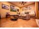 Inviting living room featuring plush seating, sports-themed decor, and a cozy atmosphere at 197 Westbrook Rd, Carrollton, GA 30116