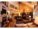 A well decorated living room with a fireplace, hardwood floors, and ample seating arrangements at 197 Westbrook Rd, Carrollton, GA 30116