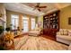 Spacious living room with coffered ceiling, hardwood floors, built-in shelves and lots of natural light at 197 Westbrook Rd, Carrollton, GA 30116