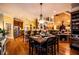 Open floor plan showcasing a dining area, kitchen, and living space with hardwood floors at 197 Westbrook Rd, Carrollton, GA 30116