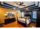 Comfortable main bedroom showcasing a blue-striped tray ceiling and coordinating decor at 197 Westbrook Rd, Carrollton, GA 30116