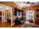 Stylish office with custom built-ins, a ceiling fan, and plantation shutters, perfect for a productive workspace at 197 Westbrook Rd, Carrollton, GA 30116