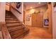 Staircase leading to lower level, with hardwood steps and sports memorabilia at 197 Westbrook Rd, Carrollton, GA 30116