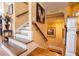 Elegant staircase with wooden banister, Gathering portraits, and warm lighting at 197 Westbrook Rd, Carrollton, GA 30116