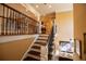 Classic staircase featuring wood steps and an iron railing with a decorative design at 197 Westbrook Rd, Carrollton, GA 30116