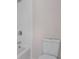 Bathroom featuring a white tiled shower, a toilet, and modern fixtures at 5003 Village Terrace Dr, Dunwoody, GA 30338