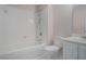 Bathroom featuring tub, shower, and toilet against a light pink wall at 5003 Village Terrace Dr, Dunwoody, GA 30338
