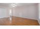 Bedroom featuring hardwood floors, white walls, and a ceiling fan at 5003 Village Terrace Dr, Dunwoody, GA 30338