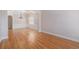 Elegant dining room with hardwood floors, chandelier, and wainscoting at 5003 Village Terrace Dr, Dunwoody, GA 30338